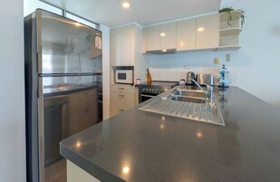 Superior Apartment, 1 Queen Bed, Terrace, Pool View | Private kitchen | Full-size fridge, microwave, stovetop, electric kettle