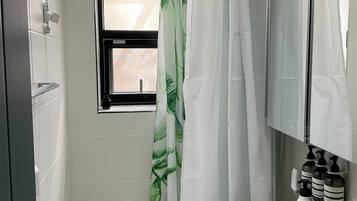 Shower, hair dryer, towels, soap