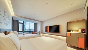A modern hotel room with two large beds, a flat-screen TV, a minibar, and a large window offering a city view. - UrCove by Hyatt Quzhou Changshan (Quzhou)