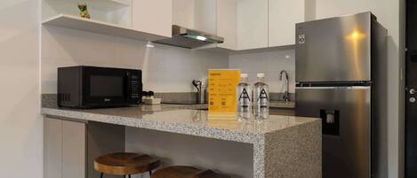 Microwave, stovetop, coffee/tea maker, toaster