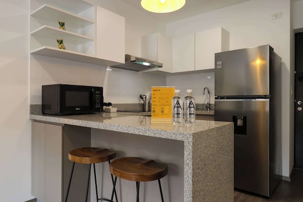 Microwave, stovetop, coffee/tea maker, toaster