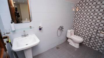 Shower, slippers, towels, soap