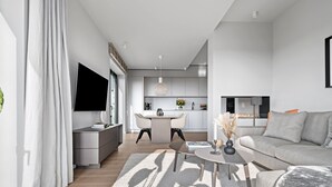 Un appartement moderne comprenant un salon, un coin repas et une cuisine.