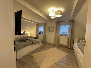 1 bedroom, desk, iron/ironing board, travel cot