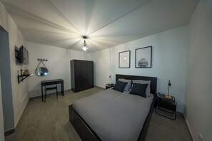 1 bedroom, desk, iron/ironing board, travel crib