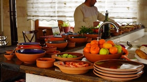 A kitchen counter with various bowls and a sink. - Glory Art Stone House (Nevsehir)