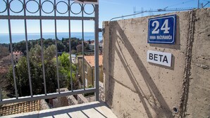 A balcony with a view of the sea, a sign indicating the number 24, and a nameplate reading "BETA". - Room Beta with sea view (Dubrovnik)