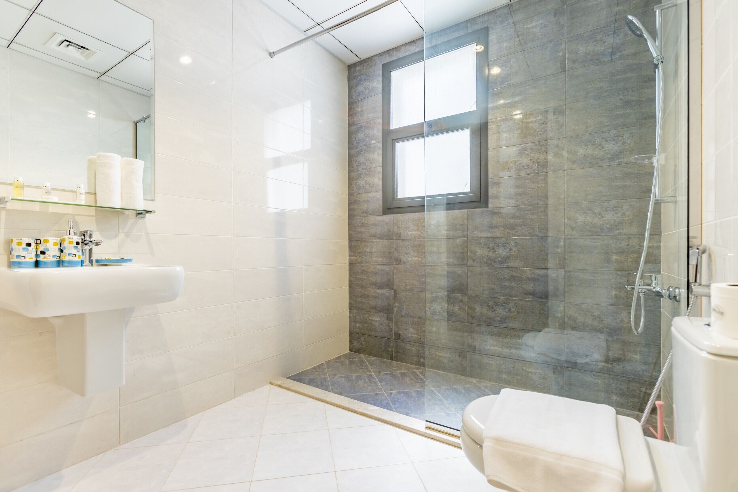 Shower, hair dryer, towels, soap