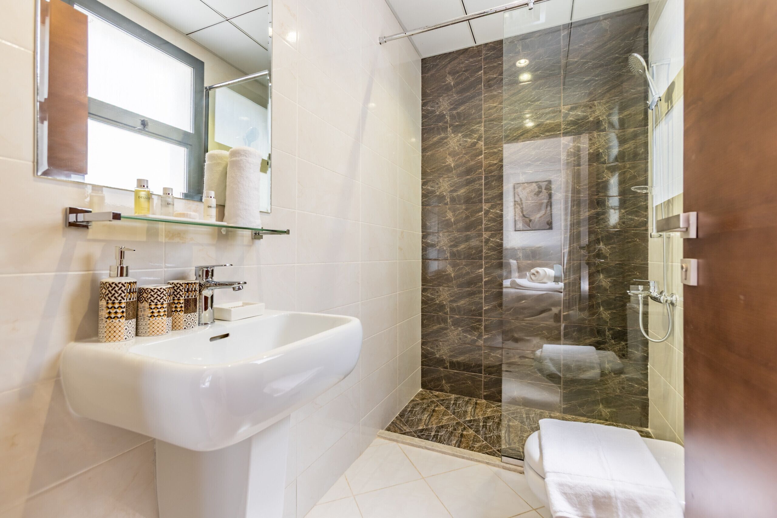 Shower, hair dryer, towels, soap