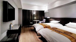 A hotel room with two beds, a desk, a chair, a TV, and a small table. - Swan Theme Culture Hotel (Zhengzhou Railway Station East Plaza Branch) (Zhengzhou)