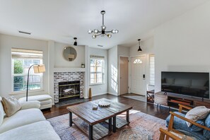 TV, fireplace, books