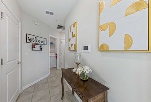 - Step into a bright and welcoming entryway designed for comfort and style
- Elegant decor, warm accents, and a personal touch set the tone for your stay
- Conveniently located near essentials, making it easy to settle in and feel at home - Kissimmee Retreat: Cozy 2BR Condo near Theme Parks (Kissimmee)