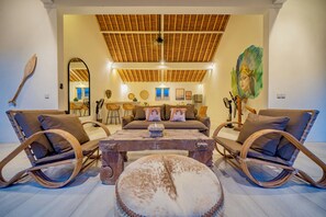 Deluxe Villa, Patio, Pool View | Living area | 32-inch LED TV with digital channels