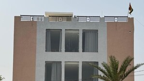A building with a sign reading "Starlight Inn Hotel & Restaurant".