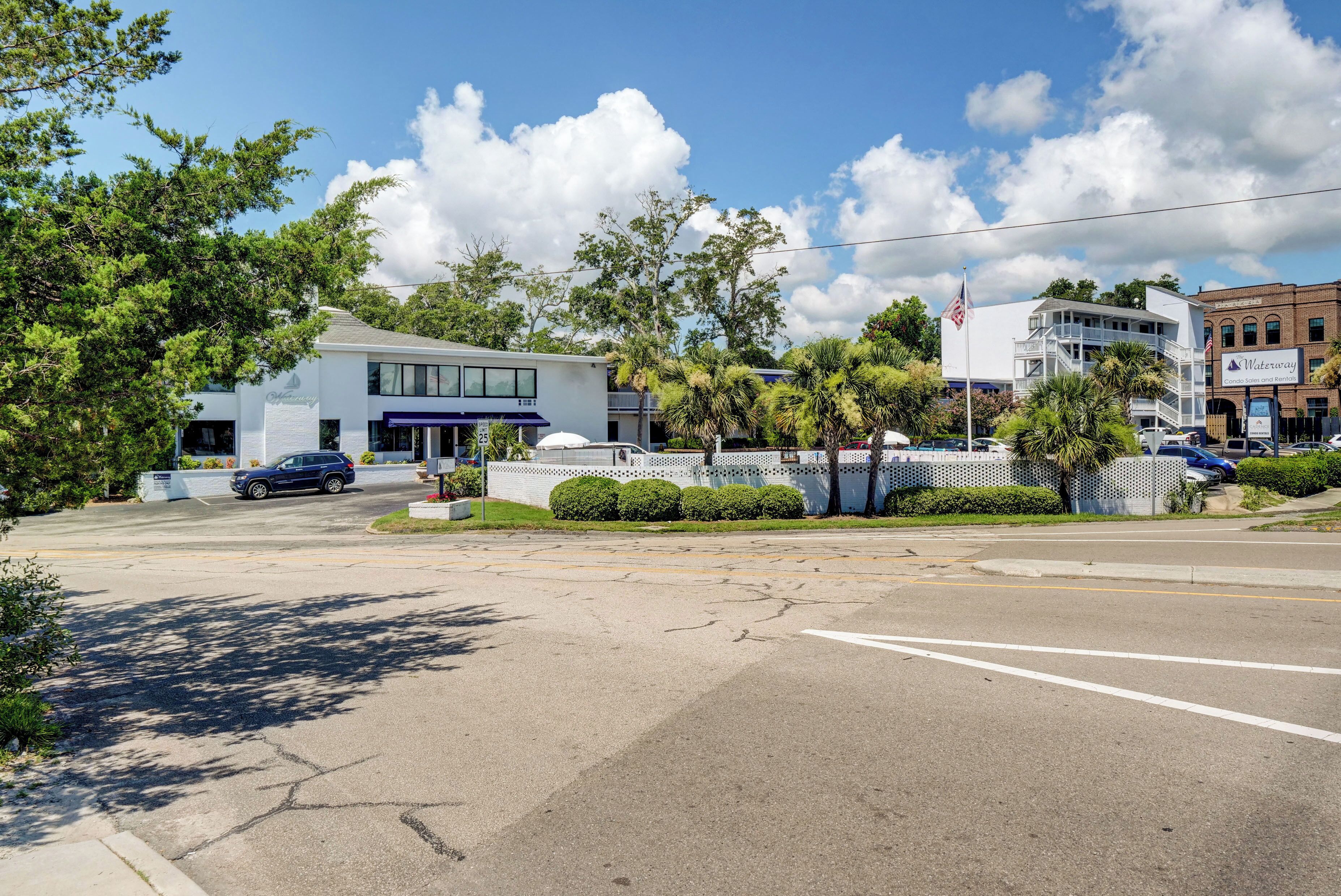 A street view with a building labeled "Waterway" and a parking lot.