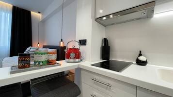 Fridge, stovetop, coffee/tea maker, spices