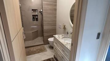 Shower, hair dryer, towels, soap