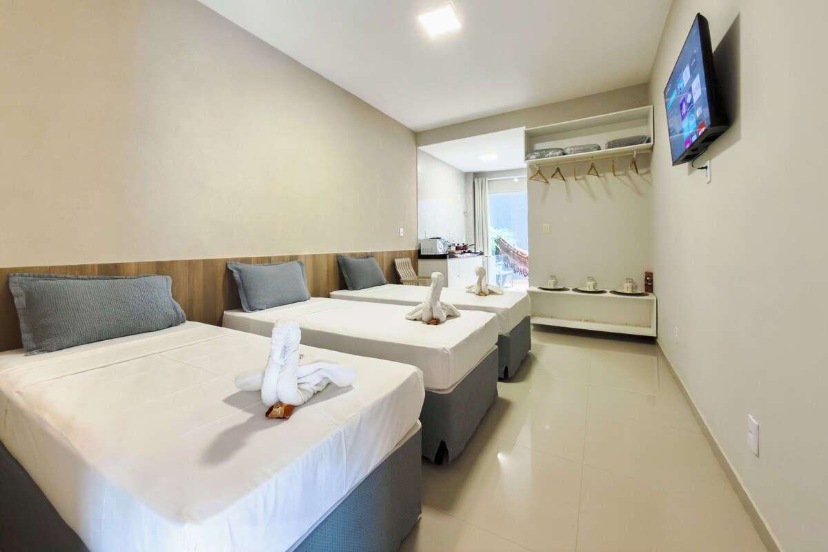 Deluxe Room, 3 Twin Beds, Ground Floor | Laptop workspace, WiFi (free), bed sheets