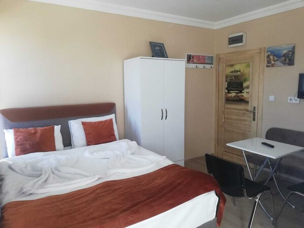 Premium bedding, desk, laptop workspace, soundproofing