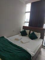 Family Quadruple Room, City View | Premium bedding, desk, laptop workspace, soundproofing