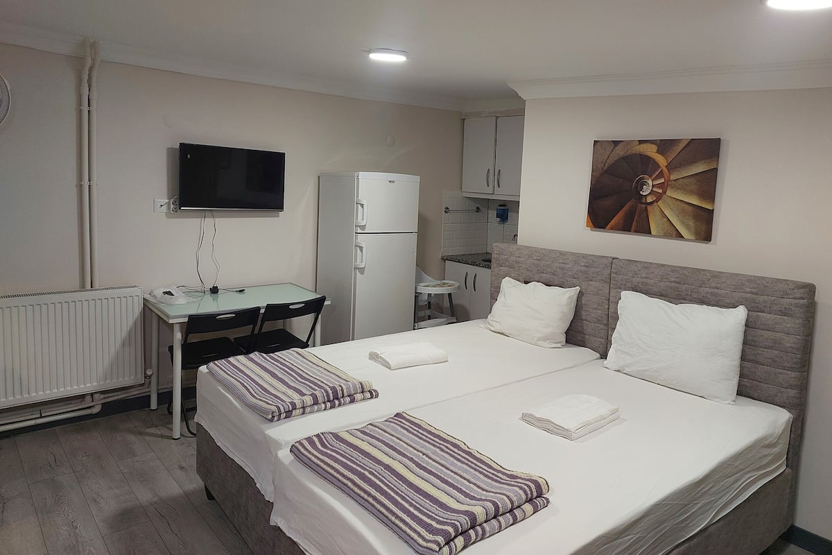 Premium bedding, desk, laptop workspace, soundproofing