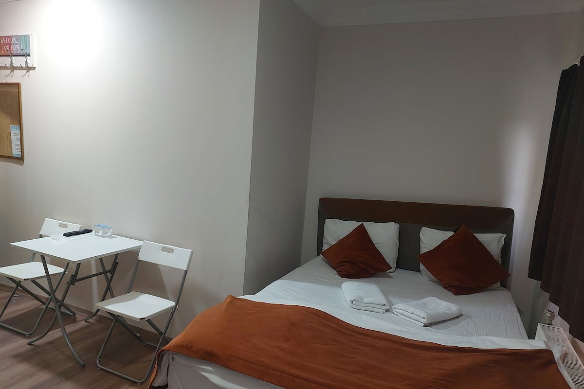 Premium bedding, desk, laptop workspace, soundproofing