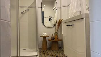 Shower, hair dryer, soap, shampoo