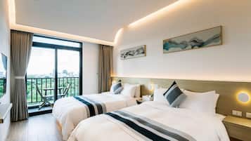 エリート 4 人部屋 バルコニー シービュー | 高級寝具、羽毛の掛け布団、セーフティボックス (室内)、遮光カーテン