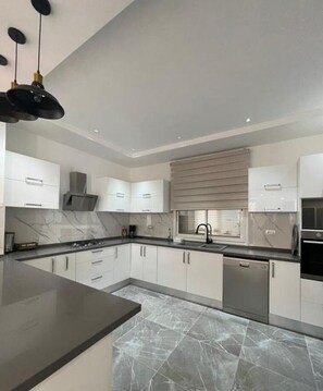 Private kitchen - Villa Dorria: A family villa with swimming pool in Aghir (Aghir)