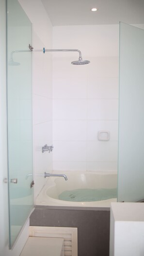 Shower, jetted tub, towels, soap
