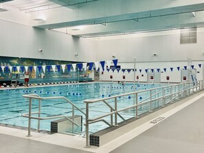 Swimmers can enjoy a safe and convenient pool experience with clear lane dividers and a lifeguard station.