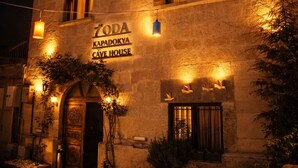 A stone building with a sign reading 'ZODA KAPADOKYA CAVE HOUSE' at night. - 7 Oda Kapadokya Cave House (Urgup)