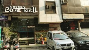 A hotel named 'Blue Bell' with a modern facade, multiple windows, and a visible entrance. - Hotel Blue Bell (New Delhi)
