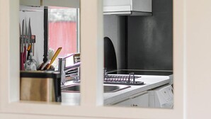 A kitchen with a window, a sink, and a cabinet. - 8 Person Holiday Home in Holbaek (Holbaek)