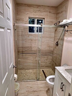 Shower, towels, soap, toilet paper