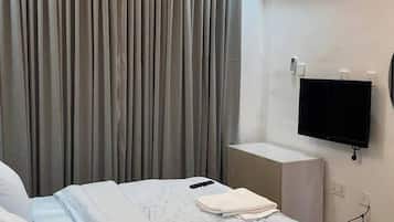 Economy Room, Balcony, City View | Desk, laptop workspace, blackout curtains, soundproofing