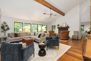 TV, fireplace, books, offices - Warm & Welcoming 4BR Cabin w/ Hot Tub, River View & Big Mountain Decks (Burnsville)