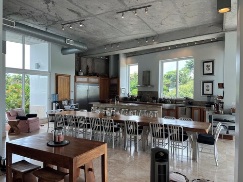 Spacious 5-bedroom house steps from beach in gated community with AC, WiFi