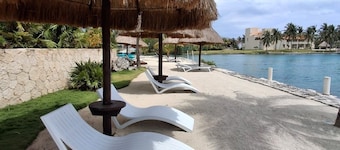 3-bedroom, 3.5 bath, waterfront condo in Puerto Aventuras with pool, wifi, A/C