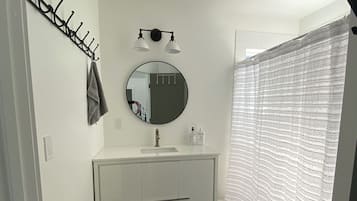 Shower, towels, soap, toilet paper