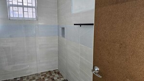 Shower, hair dryer, towels, soap - Relax & Unwind in Our Tranquil Space at Jamaica b&b rentals (Montego Bay)