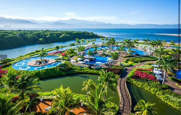 Outdoor pool, a heated pool - Vidanta 2 bedroom condo in delightful Nuevo Vallarta- Loaded!, AC, Golf & more! (Nuevo Vallarta)