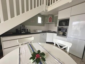 Microwave, dishwasher, dining tables