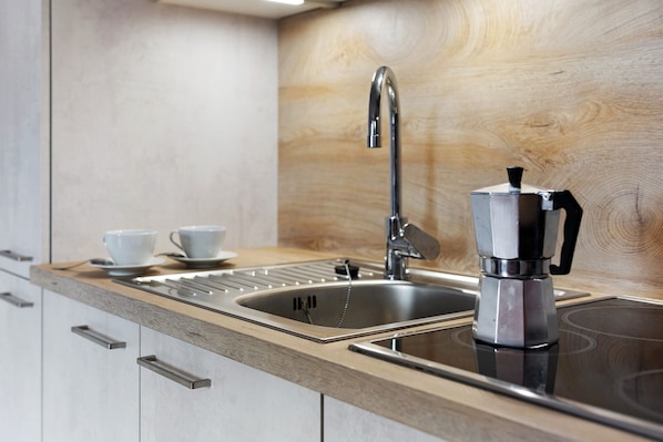 Fridge, microwave, stovetop, coffee/tea maker