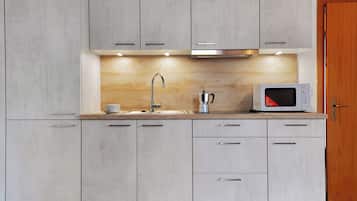 Fridge, microwave, stovetop, coffee/tea maker