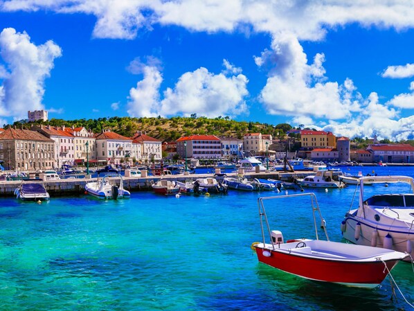 Stunning marina views from a hillside town with a mix of traditional and modern architecture.