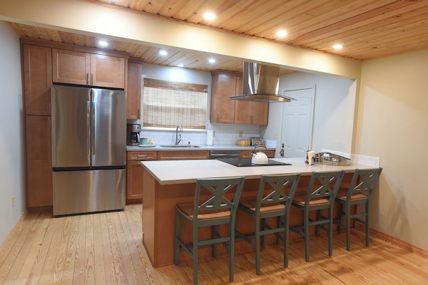 All new kitchen and island for a spot to have a quick snack or breakfast.