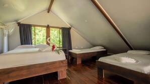 A room with two wooden beds, a ceiling fan, and a window with curtains. - Casa Sloth, enchanting private house near La Fortuna. (Provincia de Alajuela)