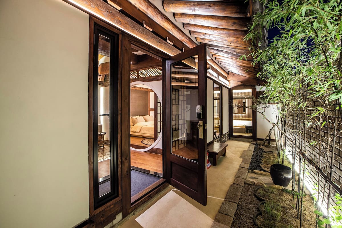 A traditional Japanese-style interior with wooden beams and tatami flooring.