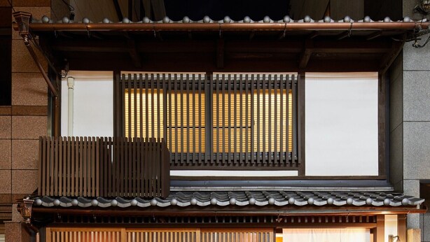 A traditional Japanese-style building with a wooden facade, a tiled roof, and a large banner with a logo. - Miro Shijo Kawaramachi Tei (Kyoto)